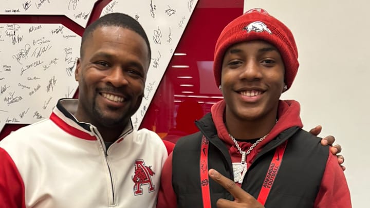 Arkansas defensive coordinator Travis Williams poses with 2027 Owasso, Okla., defensive back Bryson Brown during the Hogs Junior Day.