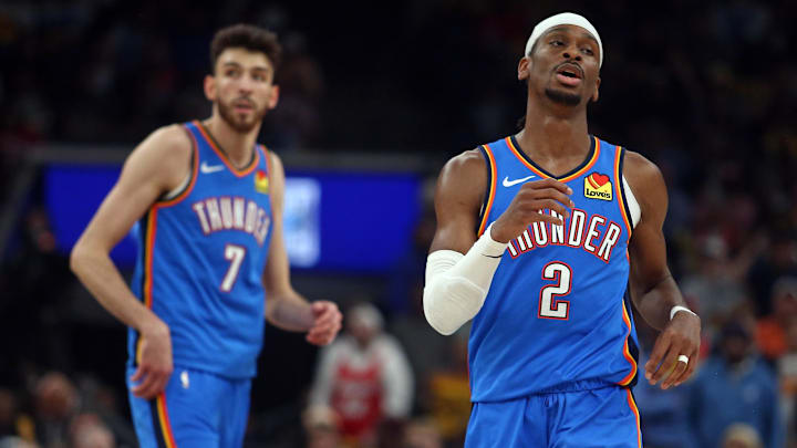 Apr 24, 2025; Memphis, Tennessee, USA; Oklahoma City Thunder guard Shai Gilgeous-Alexander (2) and forward Chet Holmgren (7) look on during the second quarter against the Memphis Grizzlies during game three for the first round of the 2024 NBA Playoffs at FedExForum. Mandatory Credit: Petre Thomas-Imagn Images
