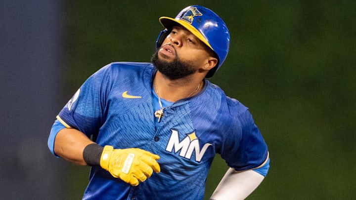 Sep 27, 2024; Minneapolis, Minnesota, USA; Minnesota Twins first baseman Carlos Santana (30) is tagged out on the bases in the ninth inning by Baltimore Orioles third baseman Ramon Urias (29) at Target Field. Mandatory Credit: Matt Blewett-Imagn Images