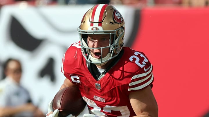 San Francisco 49ers running back Christian McCaffrey runs with the ball.