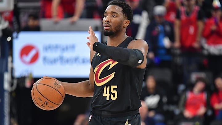 Mar 18, 2025; Inglewood, California, USA; Cleveland Cavaliers guard Donovan Mitchell (45) controls the ball against the Los Angeles Clippers during the first half at Intuit Dome. Mandatory Credit: Gary A. Vasquez-Imagn Images
