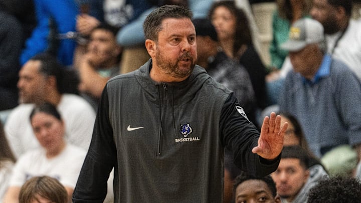 Millennium Tigers Head Coach Ty Amundsen instructs players from the sidelines at Sandra Day O'Connor High School in Phoenix on Nov. 26, 2024.