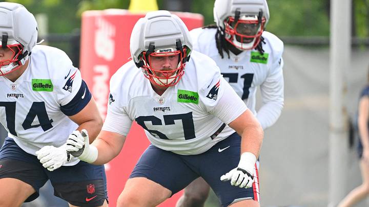 Jul 28, 2026; Foxborough, MA, USA; New England Patriots tackle Caleb Lomu (74) and offensive tackle Andrew Rupcich (67) do a drill during training camp at Gillette Stadium. Mandatory Credit: Eric Canha-Imagn Images Jul 28, 2026; Foxborough, MA, USA; New England Patriots tackle Caleb Lomu (74) and offensive tackle Andrew Rupcich (67) do a drill during training camp at Gillette Stadium. Mandatory Credit: Eric Canha-Imagn Images