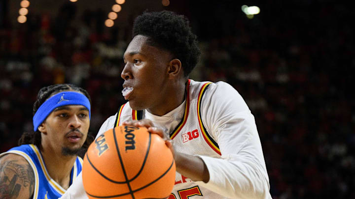 Jan 10, 2025; College Park, Maryland, USA; Maryland Terrapins center Derik Queen (25) drives to the basket against UCLA Bruins guard Skyy Clark (55) during the second half at Xfinity Center. Mandatory Credit: Reggie Hildred-Imagn Images Jan 10, 2025; College Park, Maryland, USA; Maryland Terrapins center Derik Queen (25) drives to the basket against UCLA Bruins guard Skyy Clark (55) during the second half at Xfinity Center. Mandatory Credit: Reggie Hildred-Imagn Images