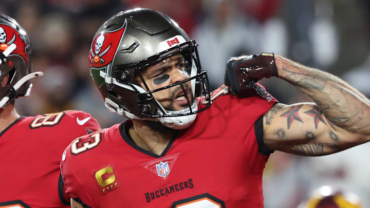 Jan 12, 2025; Tampa, Florida, USA; Tampa Bay Buccaneers wide receiver Mike Evans (13) celebrates after a touchdown catch with tight end Cade Otton (88) during the second quarter of a NFC wild card playoff against the Washington Commanders at Raymond James Stadium. Mandatory Credit: Kim Klement Neitzel-Imagn Images