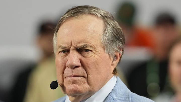 Jan 19, 2026; Miami Gardens, FL, USA; TV analyst Bill Belichick watches the Miami Hurricanes play the Indiana Hoosiers during the first half of the College Football Playoff National Championship game at Hard Rock Stadium. Mandatory Credit: Kirby Lee-Imagn Images