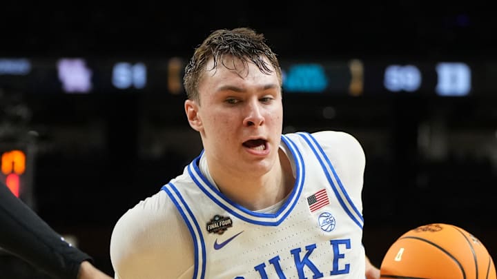 Apr 5, 2025; San Antonio, TX, USA; Duke Blue Devils forward Cooper Flagg (2) controls the ball against Houston Cougars forward J'Wan Roberts (13) during the second half in the semifinals of the men's Final Four of the 2025 NCAA Tournament at the Alamodome. Mandatory Credit: Bob Donnan-Imagn Images