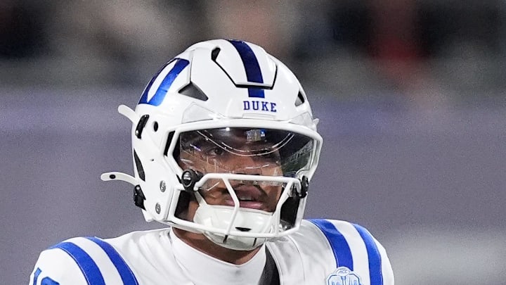 Dec 6, 2025; Charlotte, NC, USA; Duke Blue Devils quarterback Darian Mensah (10) prepares for a snap in the first quarter against the Virginia Cavaliers during the 2025 ACC Championship game at Bank of America Stadium. Mandatory Credit: Jim Dedmon-Imagn Images Dec 6, 2025; Charlotte, NC, USA; Duke Blue Devils quarterback Darian Mensah (10) prepares for a snap in the first quarter against the Virginia Cavaliers during the 2025 ACC Championship game at Bank of America Stadium. Mandatory Credit: Jim Dedmon-Imagn Images