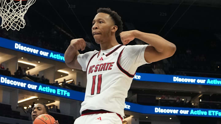 Mar 11, 2026; Charlotte, NC, USA; NC State Wolfpack guard Quadir Copeland (11) reacts after scoring in the second half at Spectrum Center. Mandatory Credit: Bob Donnan-Imagn Images