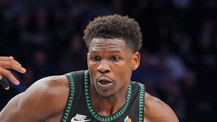 Minnesota Timberwolves guard Anthony Edwards dribbles against the Atlanta Hawks guard Nickeil Alexander-Walker.
