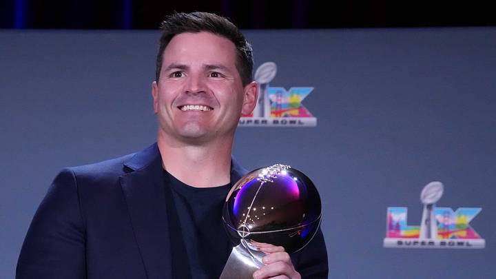 Seattle Seahawks head coach Mike MacDonald poses with the Vince Lombardi trophy.