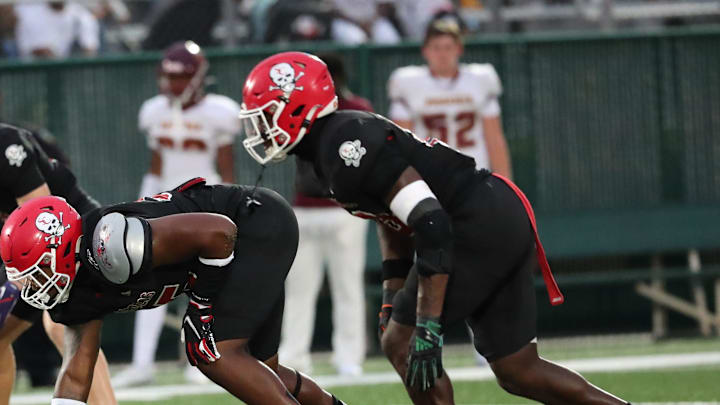 Savannah Christian's Elijah Griffin and LaDamion Guyton prepare for the snap on Friday, August 23, 2024 at Pooler Stadium. Savannah Christian's Elijah Griffin and LaDamion Guyton prepare for the snap on Friday, August 23, 2024 at Pooler Stadium.
