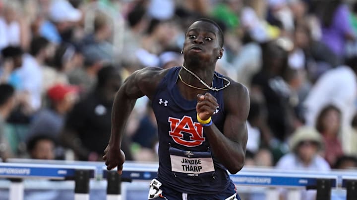 Ja’Kobe Tharp of Auburn makes history with his 3rd national title. Ja’Kobe Tharp of Auburn makes history with his 3rd national title.