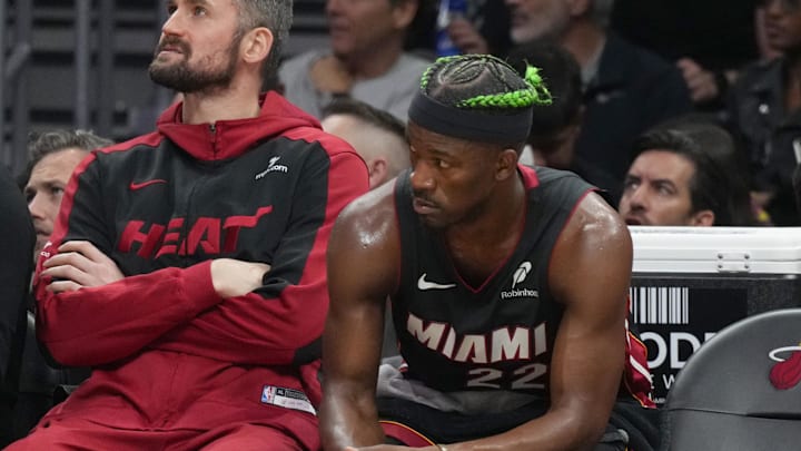 Jan 2, 2025; Miami, Florida, USA;  Miami Heat forward Jimmy Butler (22) looks on from the bench during the second half at Kaseya Center. Mandatory Credit: Jim Rassol-Imagn Images