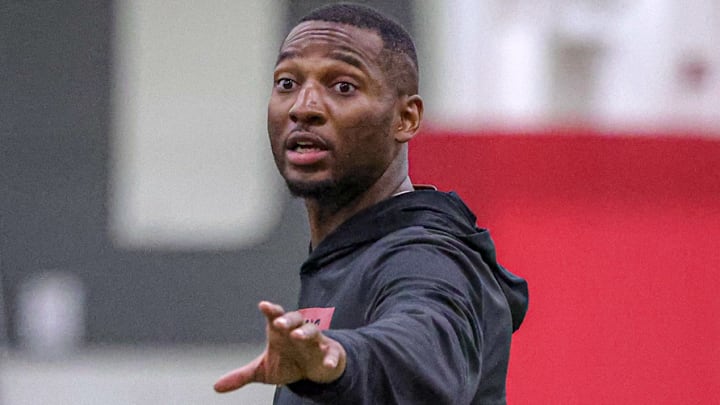 Arkansas Razorbacks secondary coach Nick Perry during preseason camp drills Tuesday at the indoor practice center in Fayetteville, Ark.
