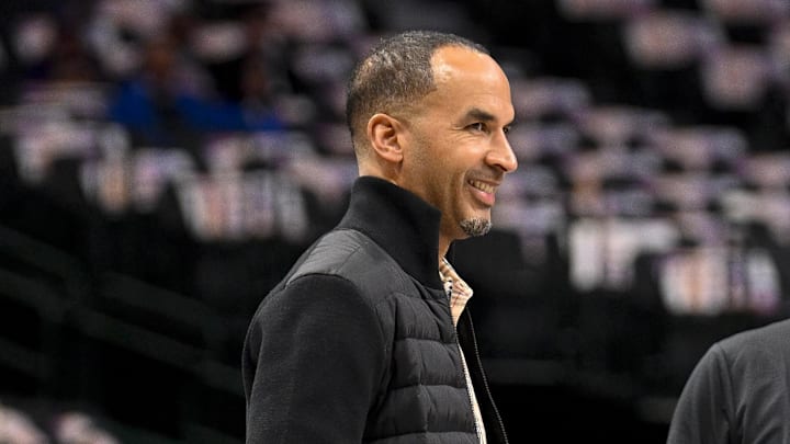 Mar 9, 2025; Dallas, Texas, USA; Dallas Mavericks general manager Nico Harrison (left) speaks with Phoenix Suns assistant coach David Fizdale (right) before the game at the American Airlines Center. Mandatory Credit: Jerome Miron-Imagn Images