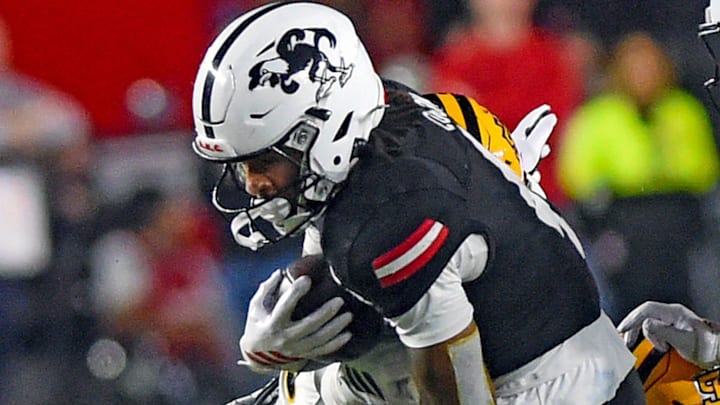 Jax State's Cam Cook tries to evade the tackle of Kennesaw State's Antonio Stevens during college school football action at AmFirst Stadium in Jacksonville, Alabama November 15, 2025. (Dave Hyatt / Hyatt Media LLC)