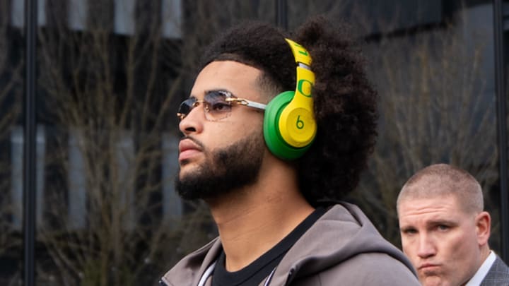 oregon ducks dante moore nfl draft texas longhorns arch manning scouts new york jets fernando mendoza dan lanning nil bo nix