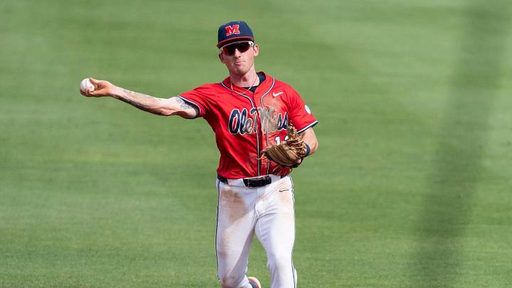 Ole Miss Rebels' Dom Decker (12) throws the ball to first base as Auburn Tigers take on Ole Miss Rebels during the NCAA Super Regional. Ole Miss Rebels' Dom Decker (12) throws the ball to first base as Auburn Tigers take on Ole Miss Rebels during the NCAA Super Regional.
