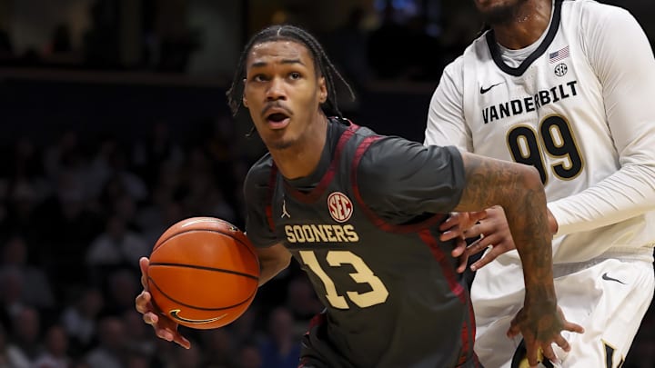 Oklahoma Sooners forward Tae Davis (13) drives to the basket against the Vanderbilt Commodores during the first half at Memorial Gymnasium.