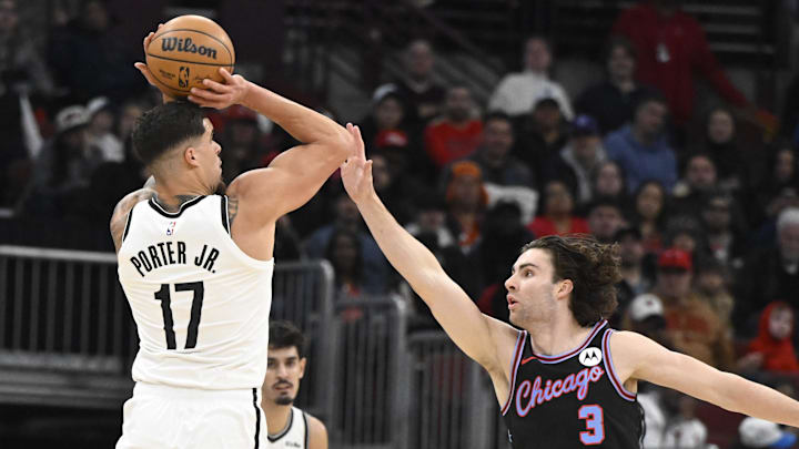 Dec 3, 2025; Chicago, Illinois, USA;  Brooklyn Nets forward Michael Porter Jr. (17) shoots against Chicago Bulls guard Josh Giddey (3) during the first half at the United Center. Mandatory Credit: Matt Marton-Imagn Images