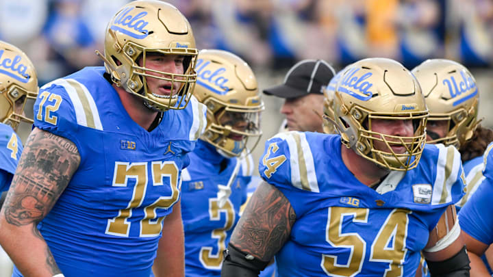 Nov 30, 2024; Pasadena, California, USA; UCLA Bruins offensive linemen Garrett DiGiorgio (72) and Josh Carlin (54) during the second quarter against the Fresno State Bulldogs at Rose Bowl. Mandatory Credit: Robert Hanashiro-Imagn Images