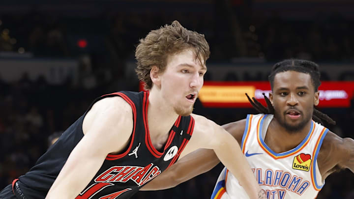 Mar 31, 2025; Oklahoma City, Oklahoma, USA; Chicago Bulls forward Matas Buzelis (14) drives to the basket around Oklahoma City Thunder guard Cason Wallace (22) during the second half at Paycom Center. Mandatory Credit: Alonzo Adams-Imagn Images