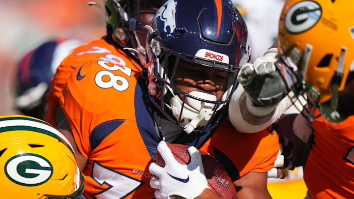 Denver Broncos running back Jaleel McLaughlin runs against the Packers during their game in 2023.