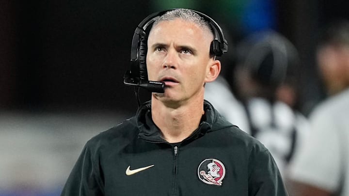 Dec 2, 2023; Charlotte, NC, USA;  Florida State Seminoles head coach Mike Norvell walks the sidelines during the third quarter against the Louisville Cardinals at Bank of America Stadium. Mandatory Credit: Jim Dedmon-Imagn Images