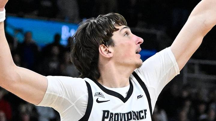 Dec 20, 2024; Providence, Rhode Island, USA; St. John's Red Storm guard Deivon Smith (5) shoots over Providence Friars center Anton Bonke (5) during the second half at Amica Mutual Pavilion. Dec 20, 2024; Providence, Rhode Island, USA; St. John's Red Storm guard Deivon Smith (5) shoots over Providence Friars center Anton Bonke (5) during the second half at Amica Mutual Pavilion.