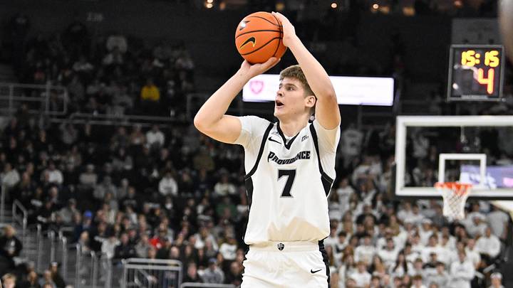 Dec 6, 2025; Providence, Rhode Island, USA; Providence Friars guard Stefan Vaaks (7) shoots the ball over Rhode Island Rams forward Tyler Cochran (23) for three points during the first half at Amica Mutual Pavilion. Mandatory Credit: Eric Canha-Imagn Images