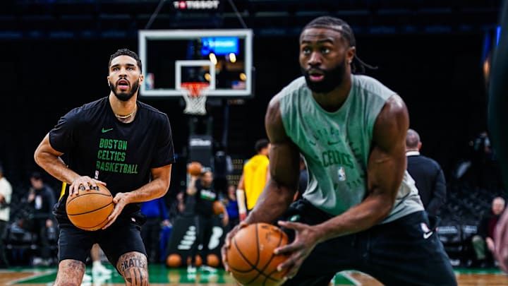 Dec 27, 2024; Boston, Massachusetts, USA; Boston Celtics forward Jayson Tatum (0) and guard Jaylen Brown (7) warms up before the start of the game against the Indiana Pacers at TD Garden. Mandatory Credit: David Butler II-Imagn Images