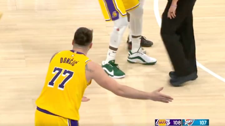 Luka Doncic reacts to getting ejected by a referee after chirping at an Oklahoma City Thunder fan in the crowd. 