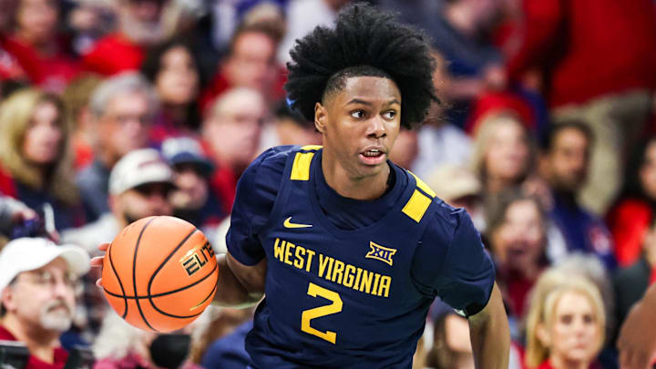 Jan 24, 2026; Tucson, Arizona, USA; West Virginia Mountaineers guard Amir Jenkins (2) dribbles the ball during the first half of the game against the Arizona Wildcats at McKale Memorial Center. Mandatory Credit: Aryanna Frank-Imagn Images
