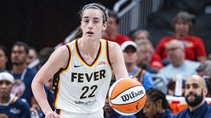 Jul 9, 2025; Indianapolis, Indiana, USA; Indiana Fever guard Caitlin Clark (22) dribbles the ball in the first half against Golden State Valkyries at Gainbridge Fieldhouse. Mandatory Credit: Trevor Ruszkowski-Imagn Images