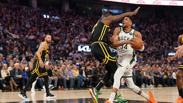 Mar 6, 2024; San Francisco, California, USA; Milwaukee Bucks forward Giannis Antetokounmpo (34) runs into Golden State Warriors forward Draymond Green (23) in the second quarter at the Chase Center. Mandatory Credit: Cary Edmondson-Imagn Images