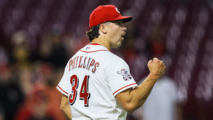 Cincinnati Reds relief pitcher Connor Phillips (34) reacts