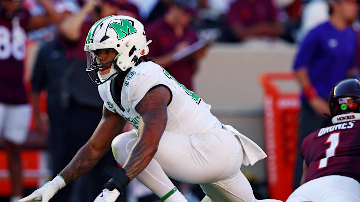 Marshall Thundering Herd edge rusher Mike Green (15) celebrates after sacking Virginia Tech Hokies QB Kyron Drones (1) 
