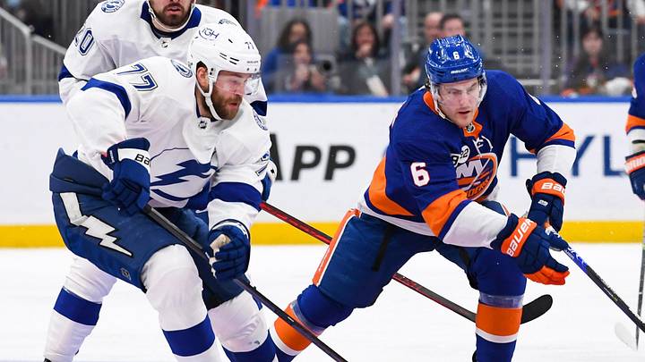Apr 29, 2022; Elmont, New York, USA; Tampa Bay Lightning defenseman Victor Hedman (77) and New York Islanders defenseman Ryan Pulock (6) chase a loose puck during the second period at UBS Arena. Mandatory Credit: Dennis Schneidler-Imagn Images