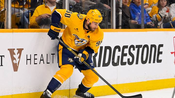 Mar 28, 2026; Nashville, Tennessee, USA;  Nashville Predators center Ryan O'Reilly (90) skates behind the net against the Montreal Canadiens during the third period Gat Bridgestone Arena. Mandatory Credit: Steve Roberts-Imagn Images