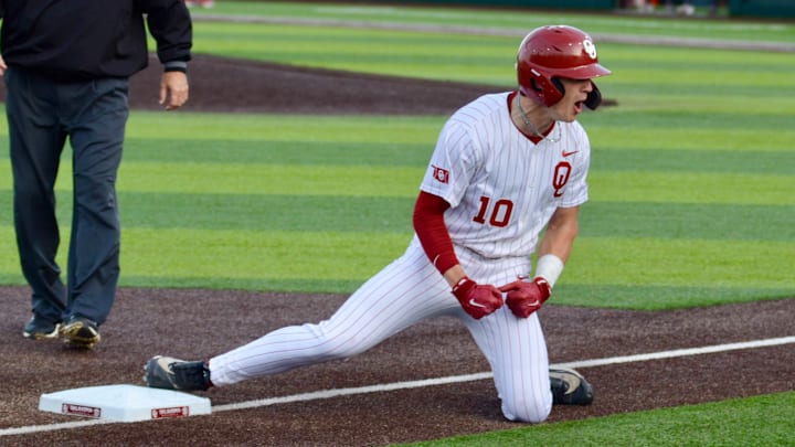Oklahoma catcher/outfielder Brendan Brock celebrates after reaching base with a triple against Texas A&M.
