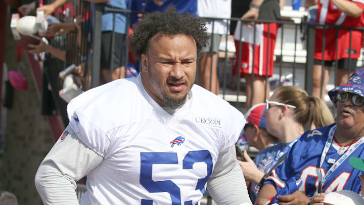 Bills offensive lineman Kendrick Green high-fives fans as the takes the field during the second day of Buffalo Bills training camp at St. John Fisher University Thursday, July 24, 2025 in Pittsford.