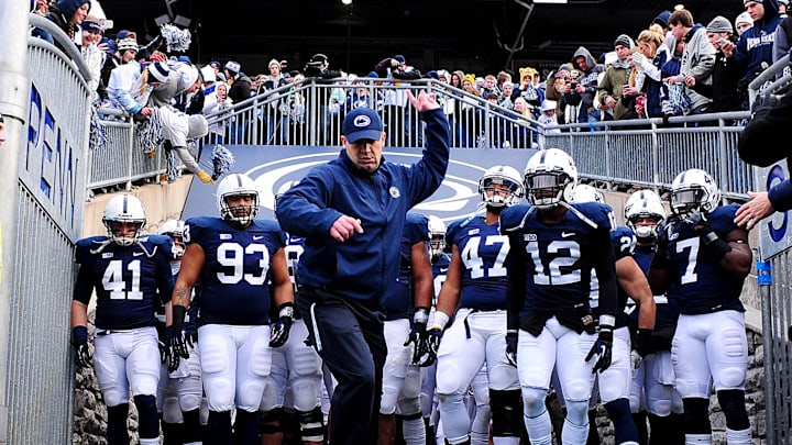 Penn State Nittany Lions football coach Bill O'Brien leads the team into Beaver Stadium vs. the Wisconsin Badgers in 2012.
