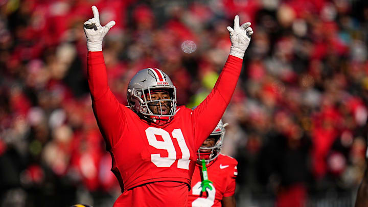 Ohio State Buckeyes defensive tackle Tyleik Williams (91) motions at the line during the first half against Michigan 
