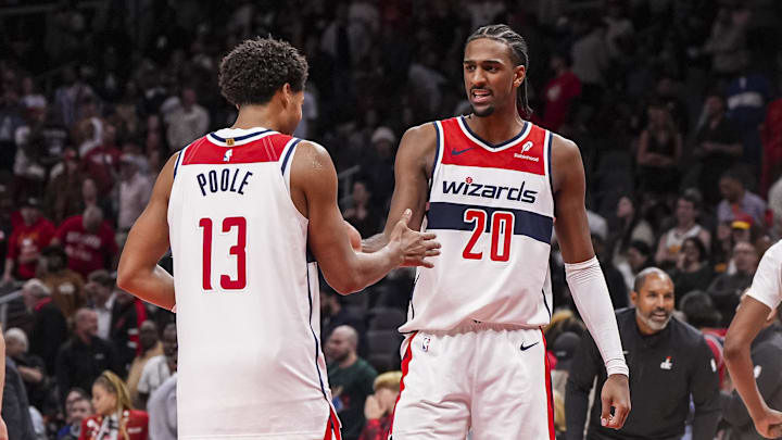 Oct 28, 2024; Atlanta, Georgia, USA; Washington Wizards guard Jordan Poole (13) and forward Alexandre Sarr (20) react after the Wizards defeated the Atlanta Hawks at State Farm Arena. Mandatory Credit: Dale Zanine-Imagn Images