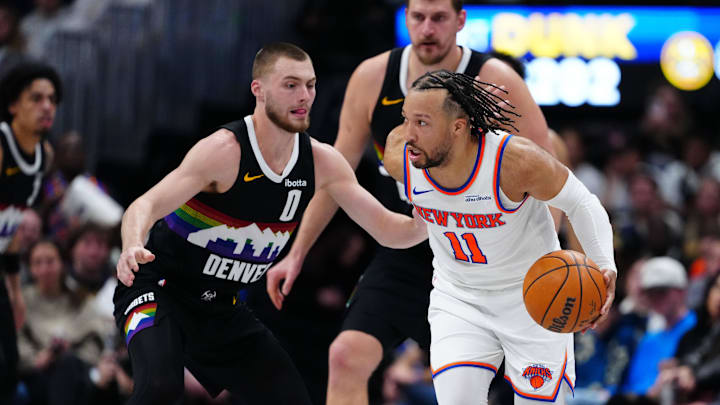 Mar 6, 2026; Denver, Colorado, USA; Denver Nuggets guard Christian Braun (0) defends New York Knicks guard Jalen Brunson (11) in the second quarter at Ball Arena. Mandatory Credit: Ron Chenoy-Imagn Images