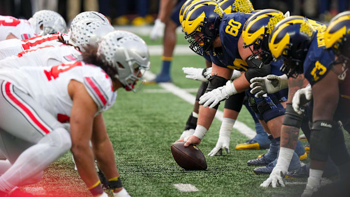 Michigan Wolverines offensive lineman Drake Nugent (60) prepares to snap the ball 
