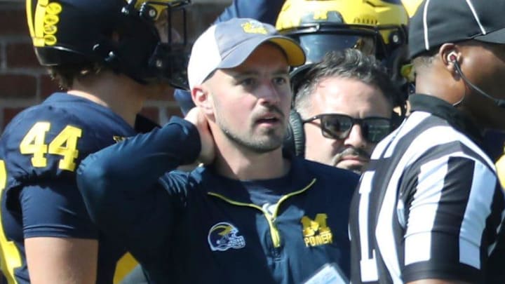 Connor Stalions, left, stands next to Michigan coach Jim Harbaugh during the team's game against Rutgers, Sept. 23, 2023 at Michigan Stadium in Ann Arbor. Connor Stalions, left, stands next to Michigan coach Jim Harbaugh during the team's game against Rutgers, Sept. 23, 2023 at Michigan Stadium in Ann Arbor.