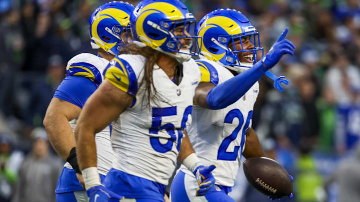 Nov 3, 2024; Seattle, Washington, USA; Los Angeles Rams safety Kamren Kinchens (26) celebrates following an interception against the Seattle Seahawks during the fourth quarter at Lumen Field. Mandatory Credit: Joe Nicholson-Imagn Images Nov 3, 2024; Seattle, Washington, USA; Los Angeles Rams safety Kamren Kinchens (26) celebrates following an interception against the Seattle Seahawks during the fourth quarter at Lumen Field. Mandatory Credit: Joe Nicholson-Imagn Images