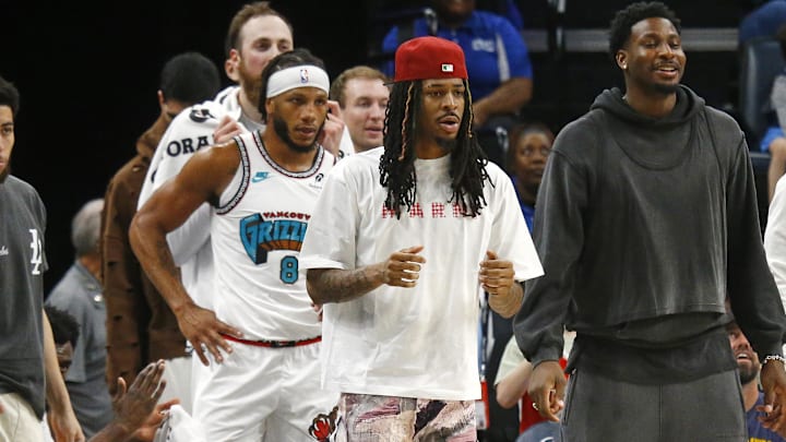 Apr 13, 2025; Memphis, Tennessee, USA; Memphis Grizzlies guard Ja Morant (left), forward Jaren Jackson Jr. (middle) and guard Desmond Bane (22) look on from the bench area during the second quarter against the Dallas Mavericks at FedExForum. Mandatory Credit: Petre Thomas-Imagn Images Apr 13, 2025; Memphis, Tennessee, USA; Memphis Grizzlies guard Ja Morant (left), forward Jaren Jackson Jr. (middle) and guard Desmond Bane (22) look on from the bench area during the second quarter against the Dallas Mavericks at FedExForum. Mandatory Credit: Petre Thomas-Imagn Images